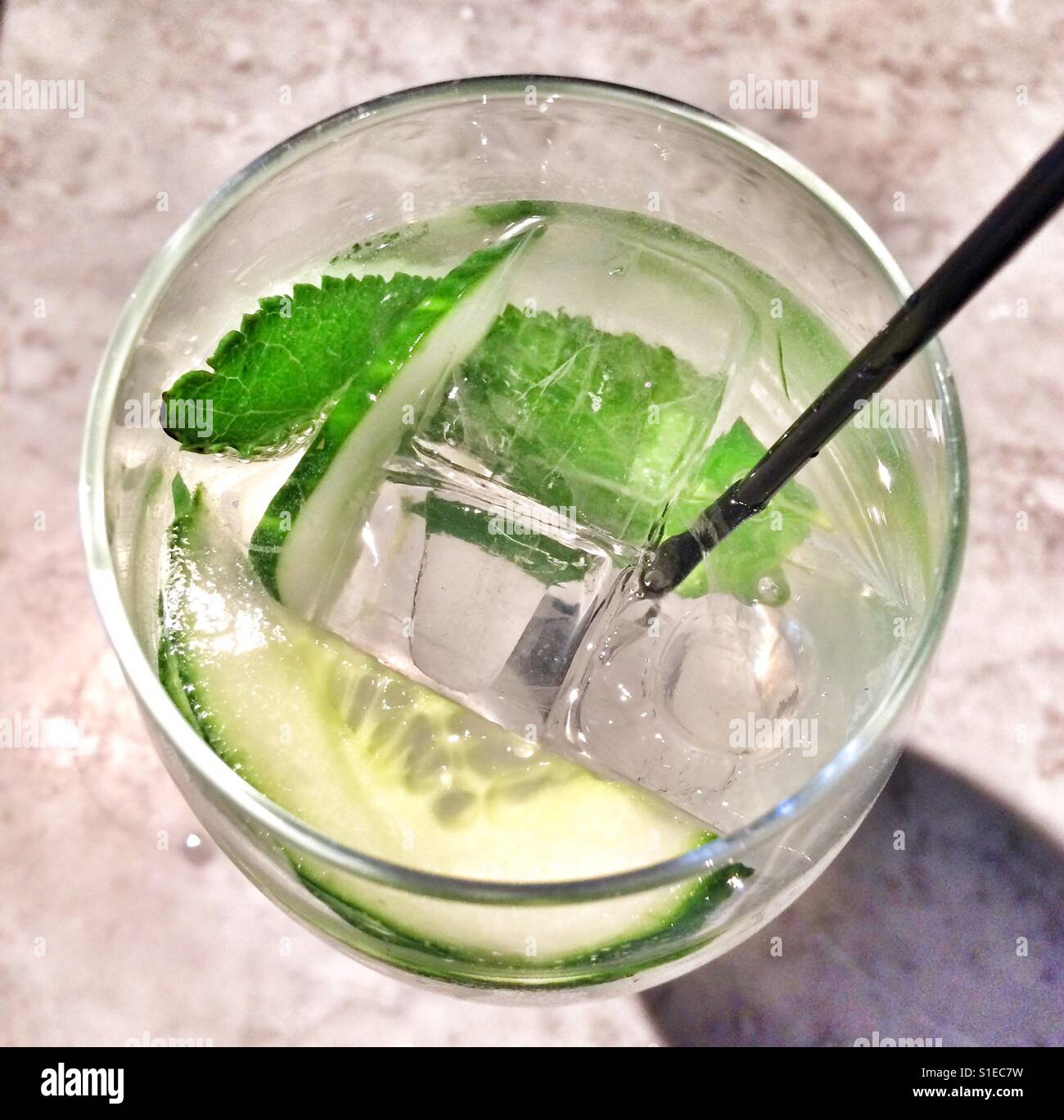 Gin and tonic with fresh mint and cucumber Stock Photo - Alamy