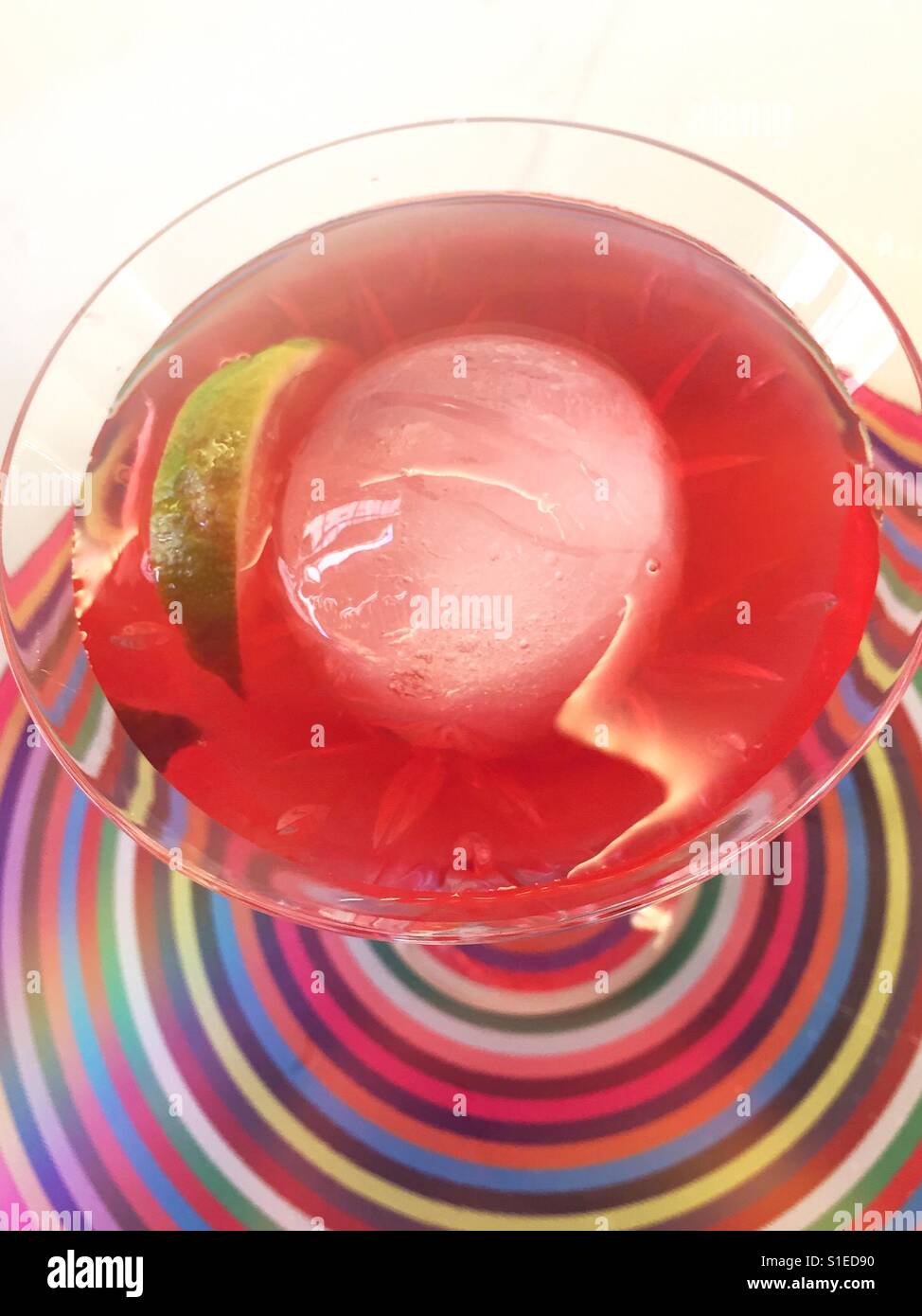 A cosmopolitan cocktail with large round ice ball in a martini glass, NYC, USA Stock Photo Alamy