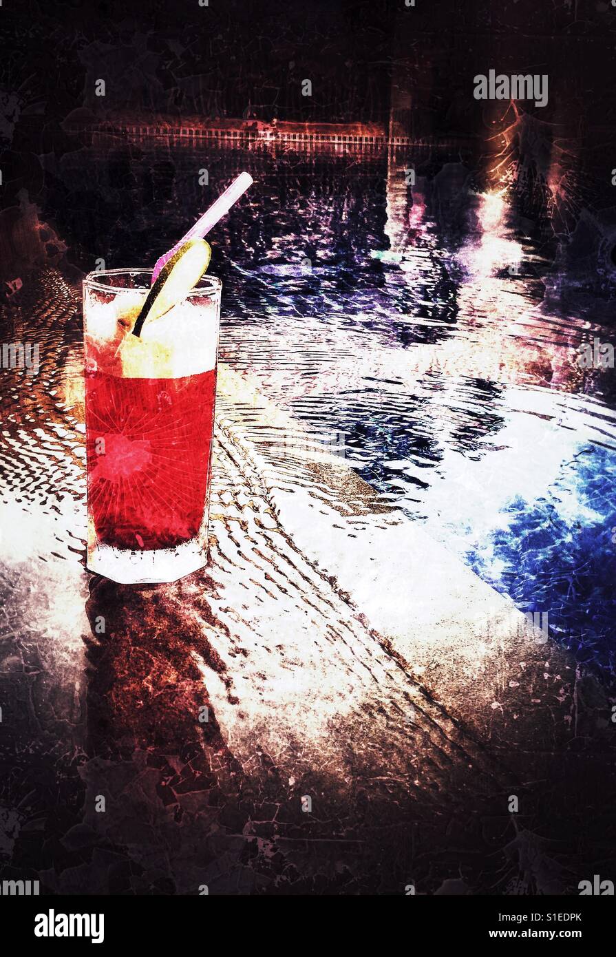 Singapore sling by the pool Stock Photo