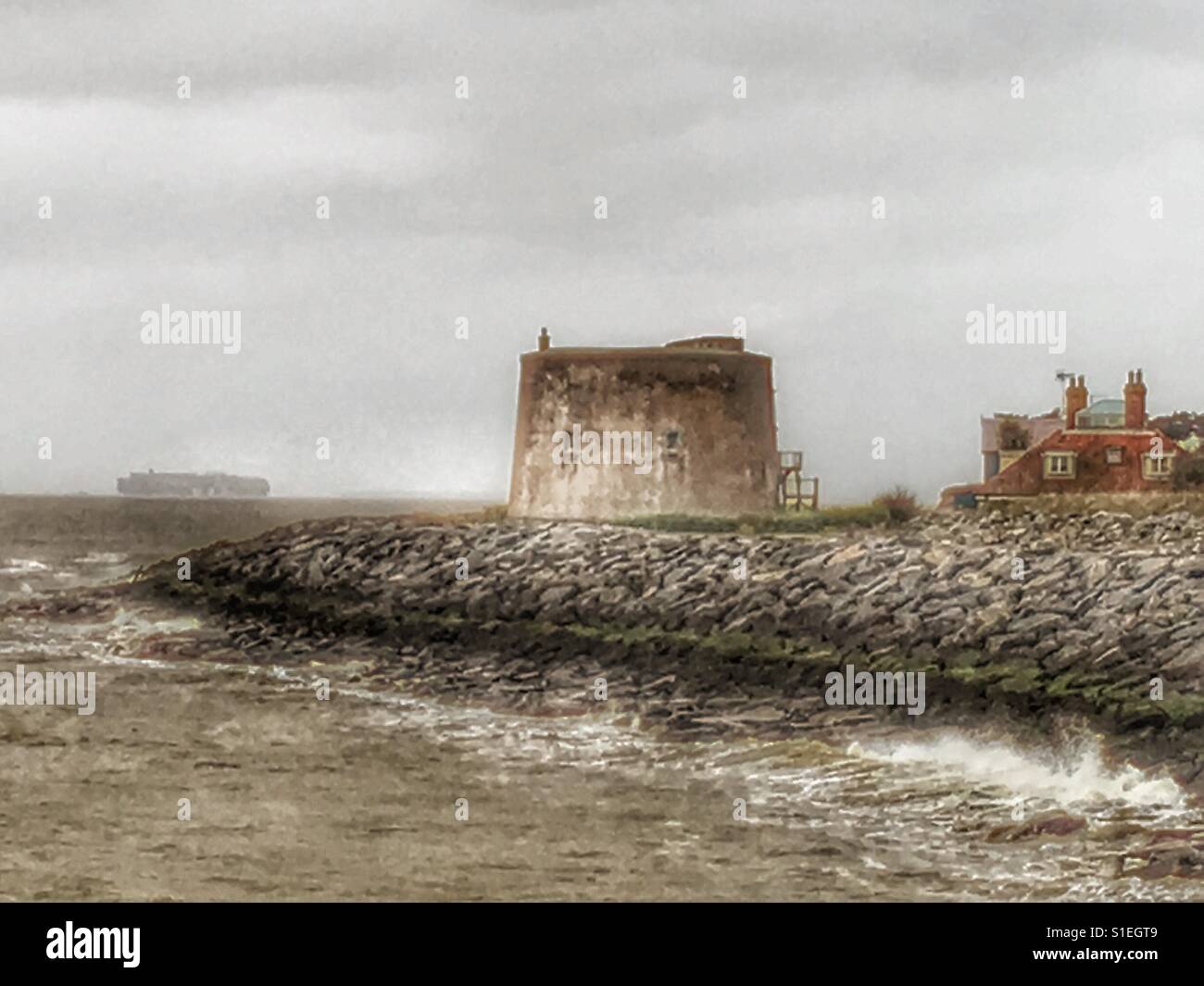 Rock armour protecting properties from coastal erosion, East Lane, Bawdsey, Suffolk, UK. - Smartphone Captured Stock Image
