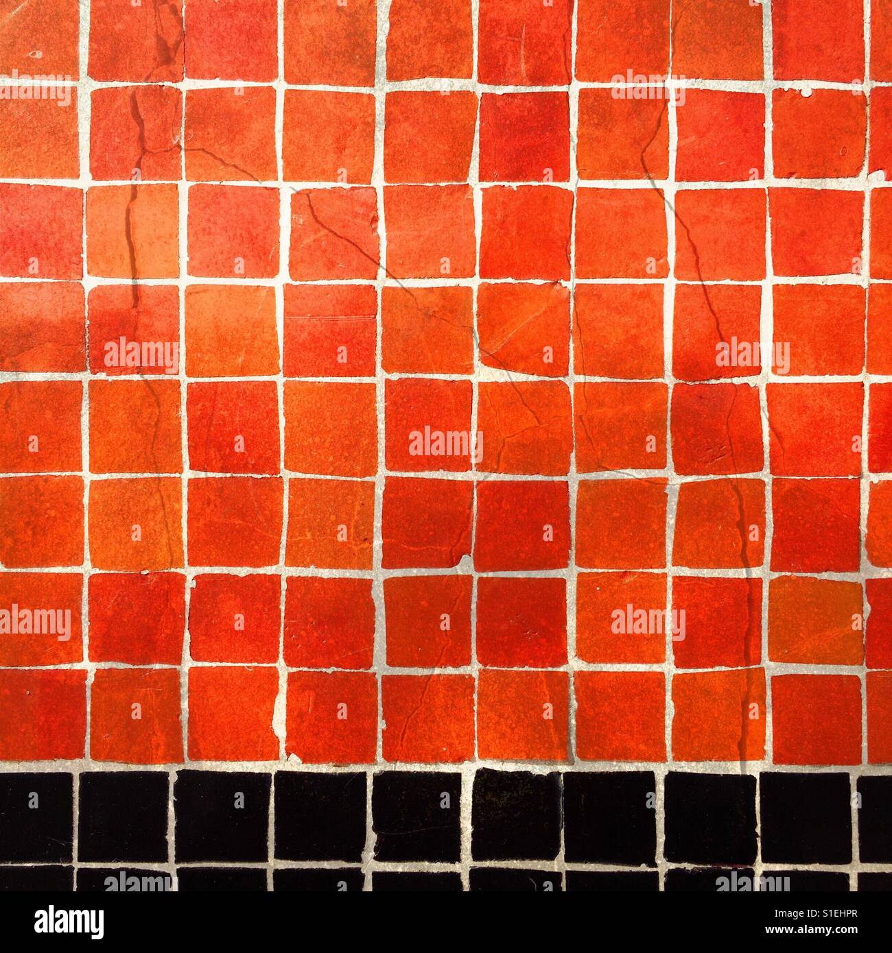 An orange and black tile wall Stock Photo Alamy