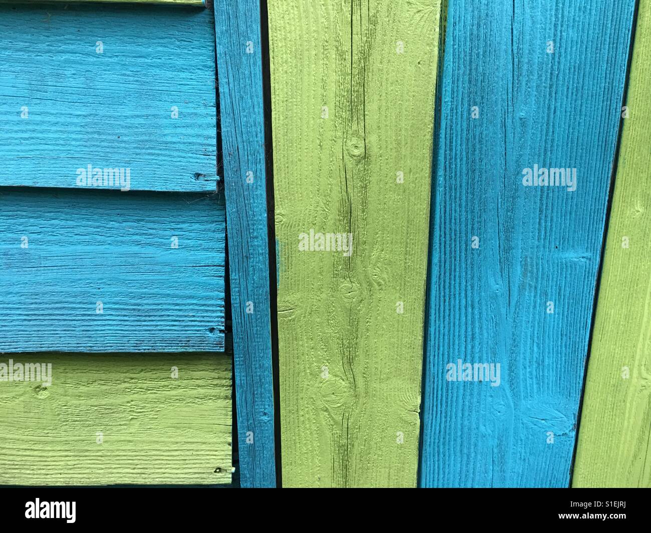Green and turquoise painted shed - Smartphone Captured Stock Image