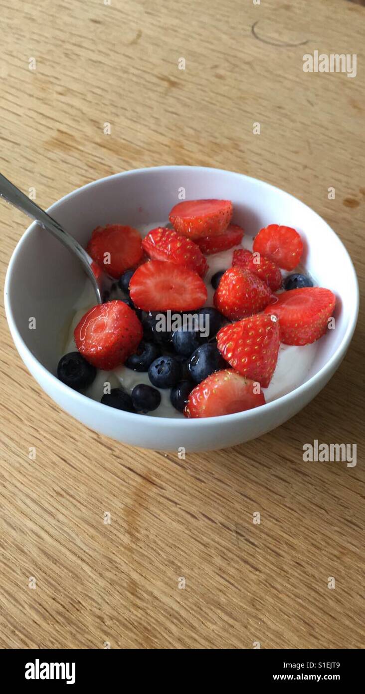 Strawberry yoghurt with blueberries Stock Photo Alamy