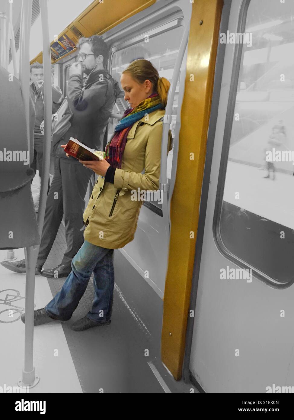 Reading on the subway - Smartphone Captured Stock Image