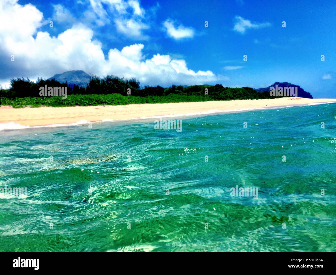 Deserted tropical island with turquoise reef - Smartphone Captured Stock Image