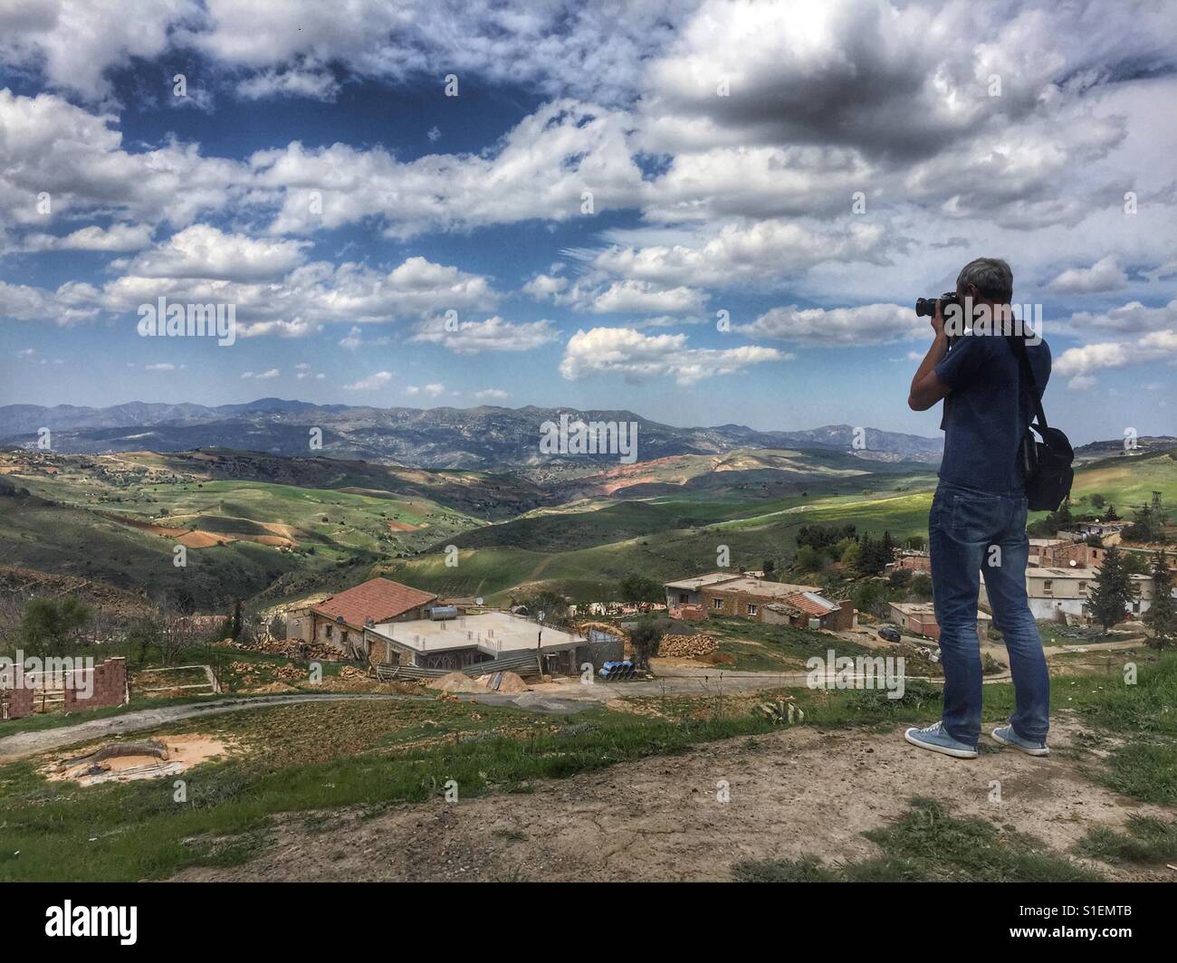 Photographer in mountains - Smartphone Captured Stock Image