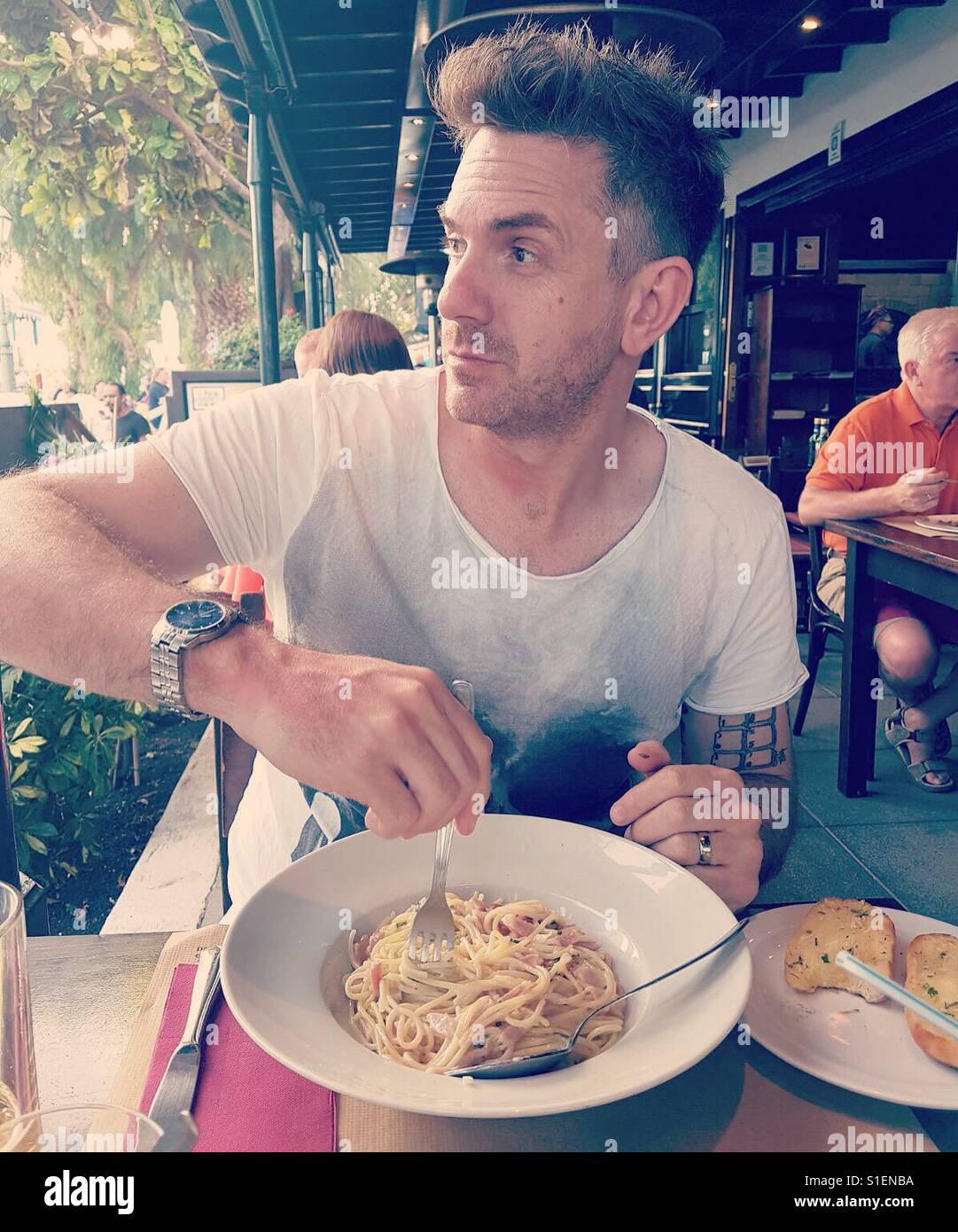Man eating pasta - Smartphone Captured Stock Image