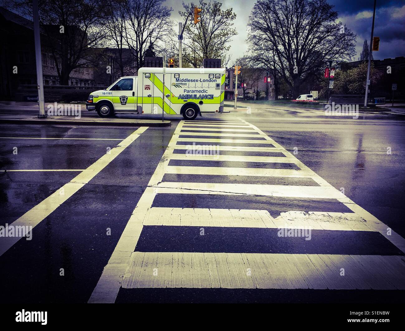 Ambulance across a crossing Stock Photo