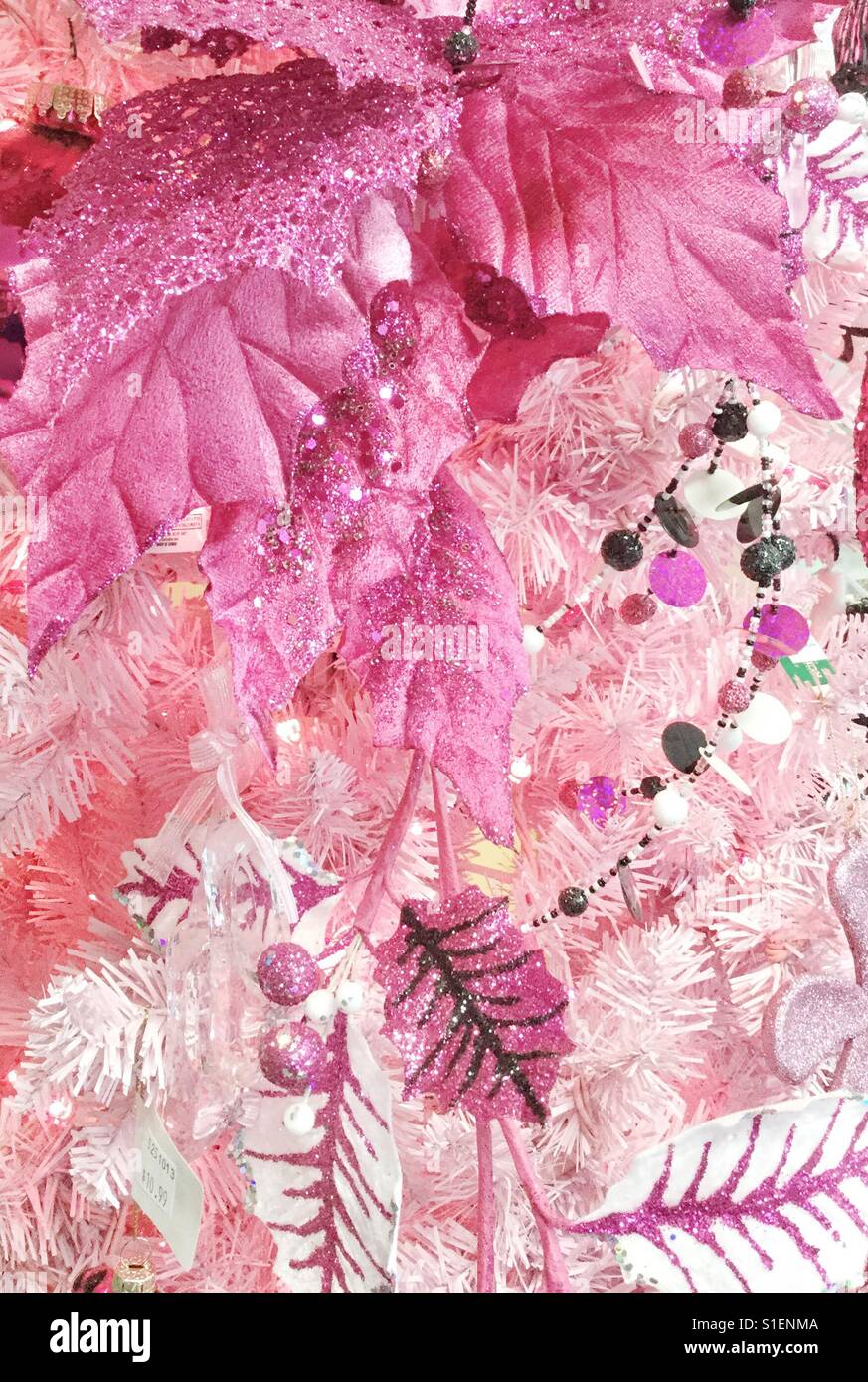 Pink Christmas ornaments on a white tree. - Smartphone Captured Stock Image