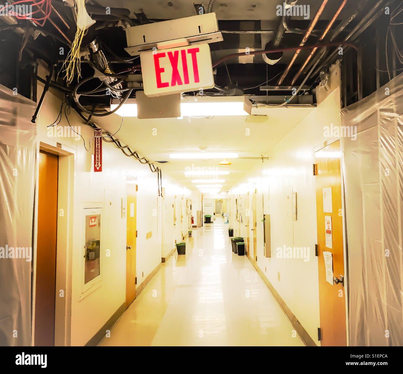 Exit sign in hospital undergoing construction Stock Photo Alamy