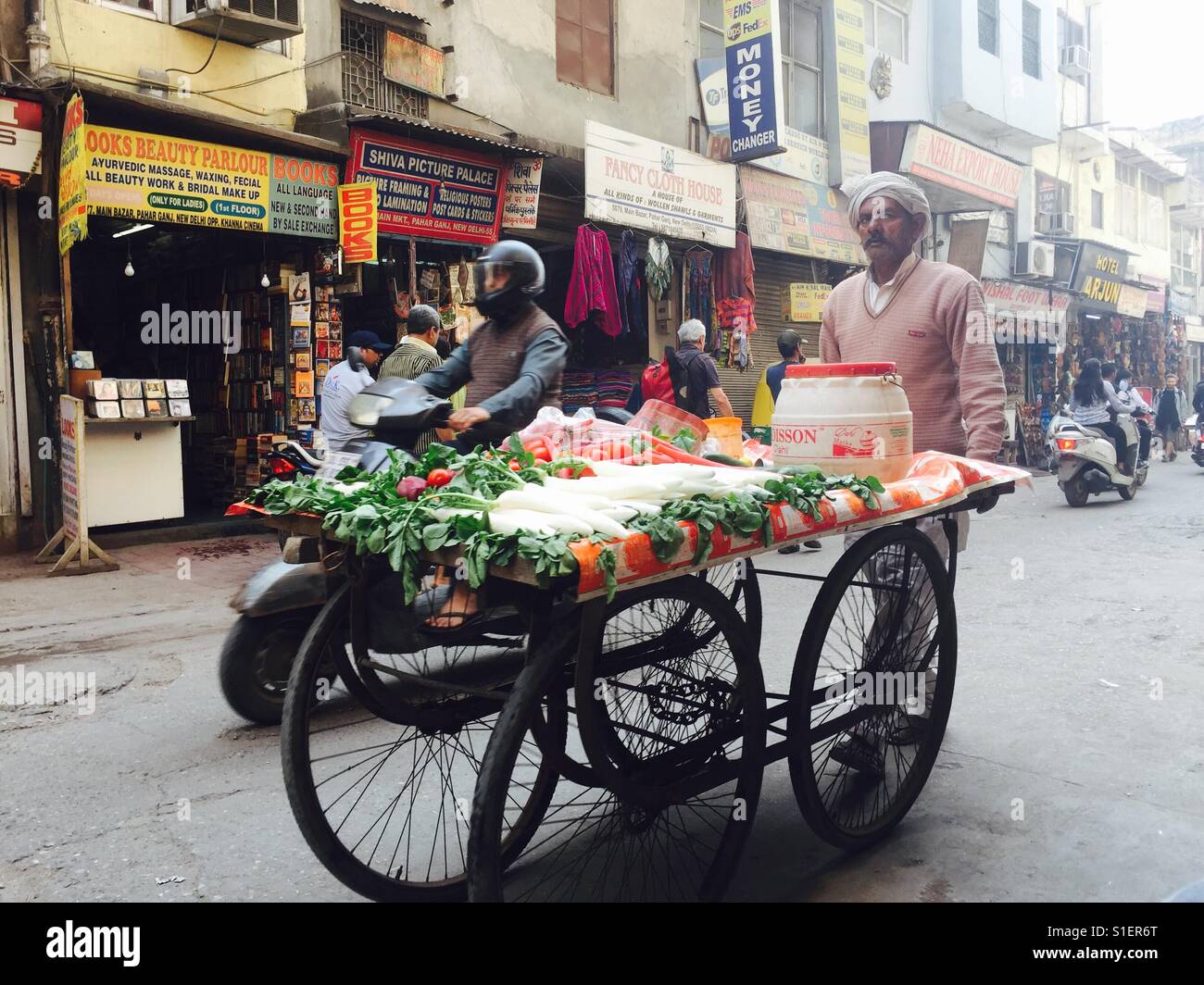Vegetable seller pushes his cart through Paharganj, India - Smartphone Captured Stock Image