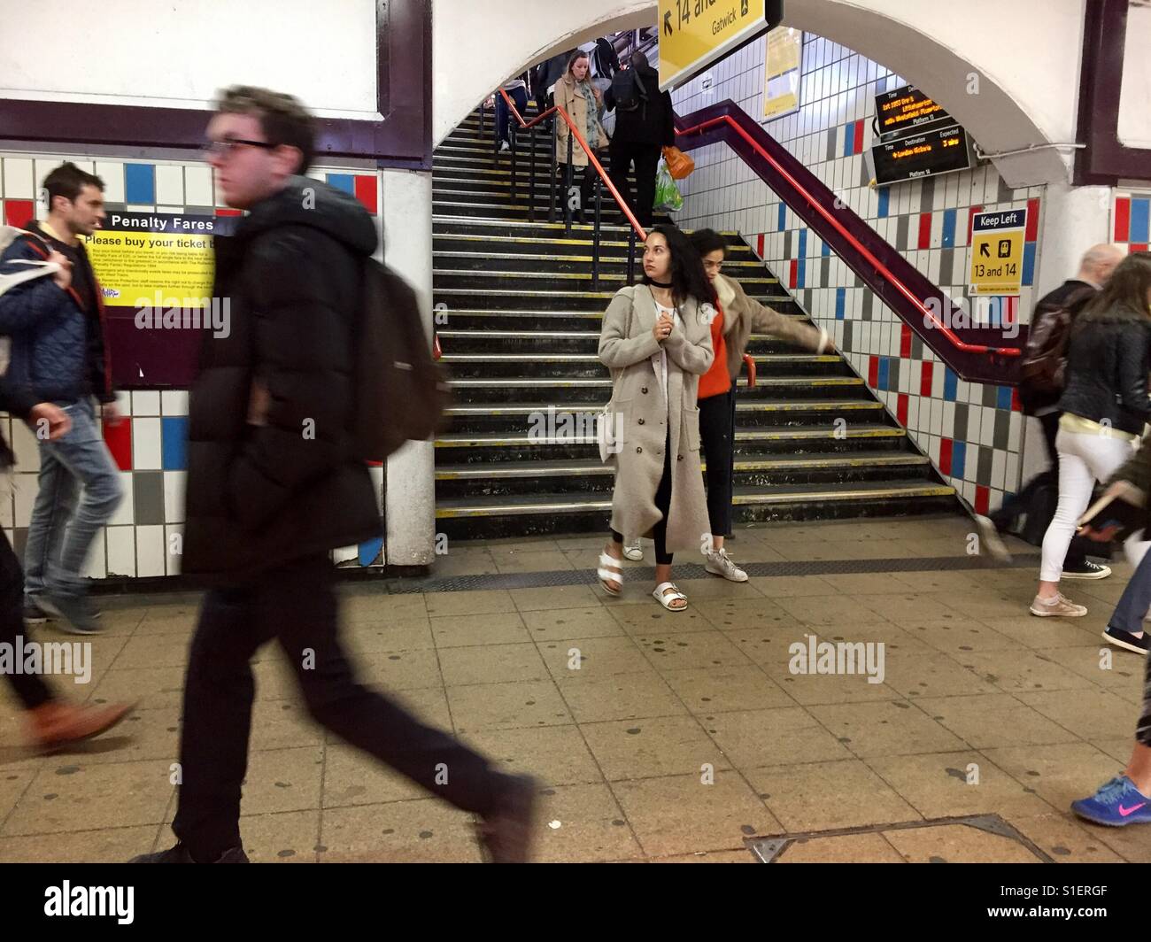 Passengers at Clapham Junction Railway Station in London, England - Smartphone Captured Stock Image
