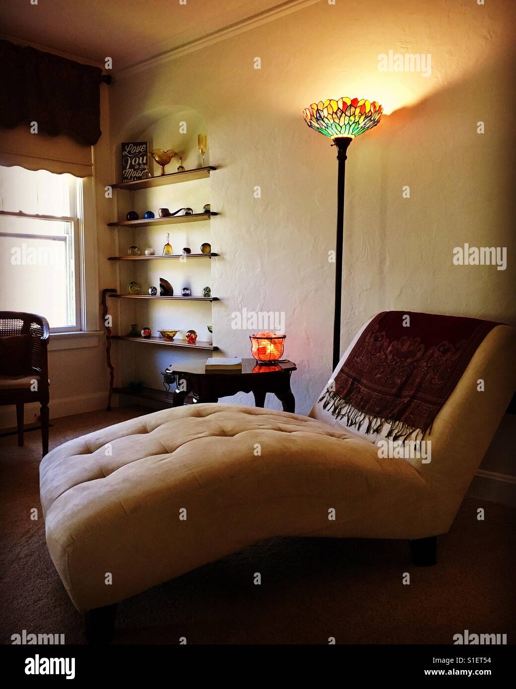My living room chaise lounge chair and tiffany lamp built in wall shelves