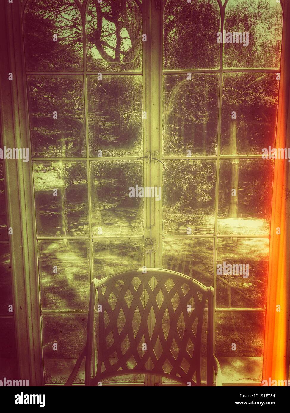 Chair by the garden window - Smartphone Captured Stock Image