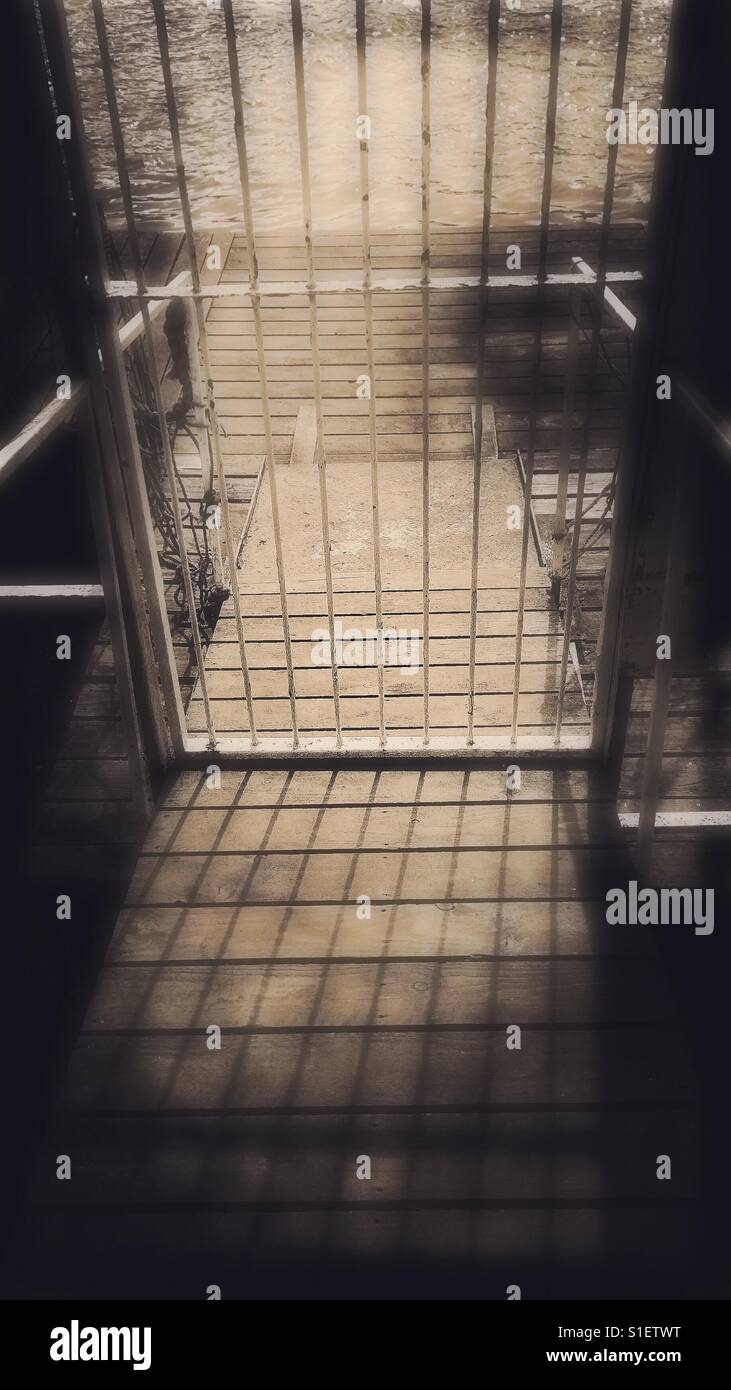 Riverside closed iron gate - Smartphone Captured Stock Image