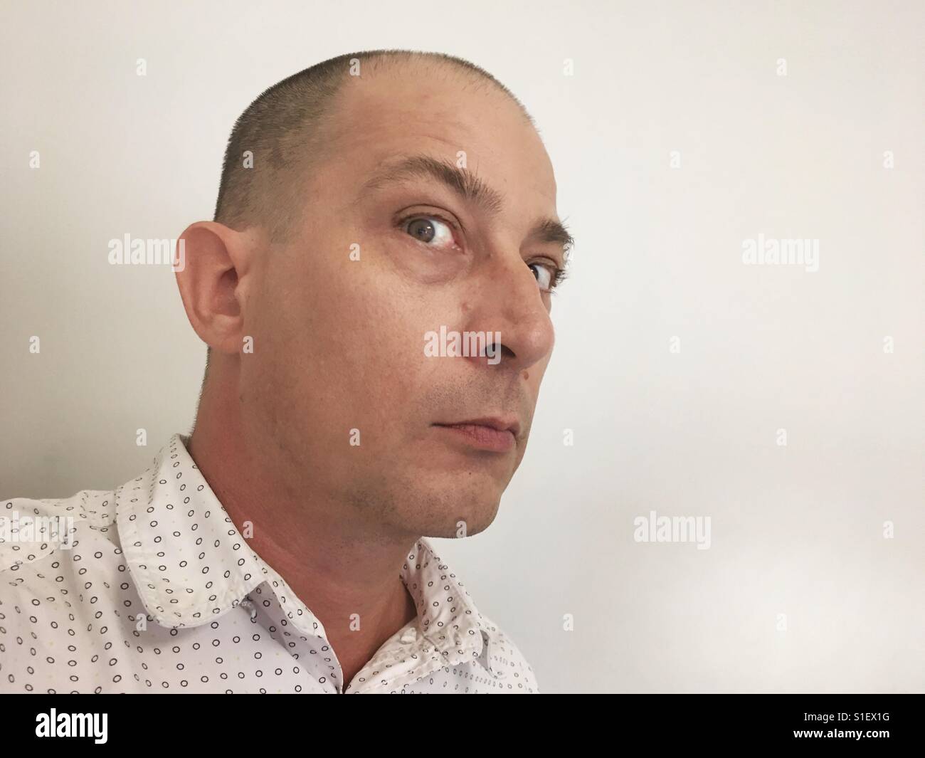 Portrait of a man being suspicious. - Smartphone Captured Stock Image