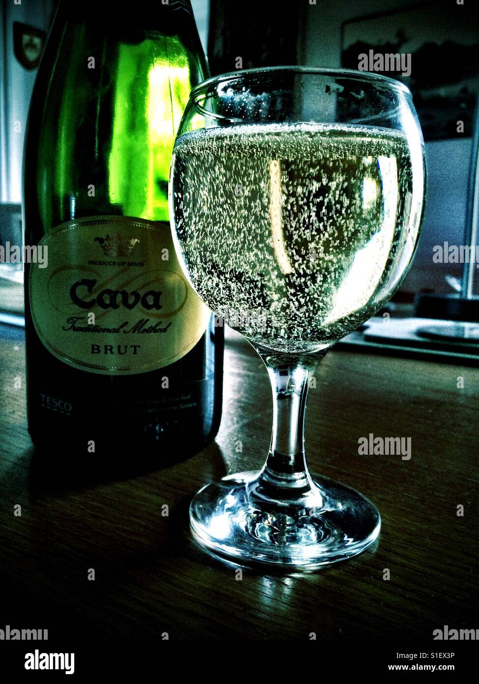 Bottle and glass of fizzy Cava wine from Spain Stock Photo