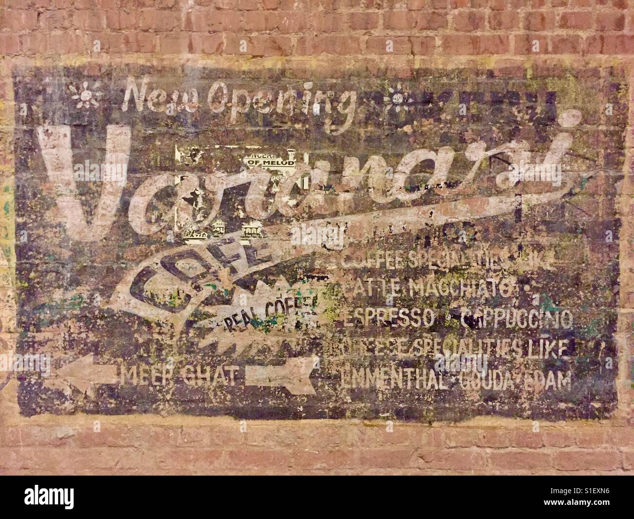 A sign advertising a cafe on a wall in Varanasi, India - Smartphone Captured Stock Image