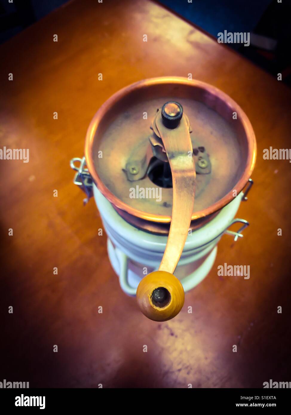 Old manual coffee grinder. From another era. - Smartphone Captured Stock Image