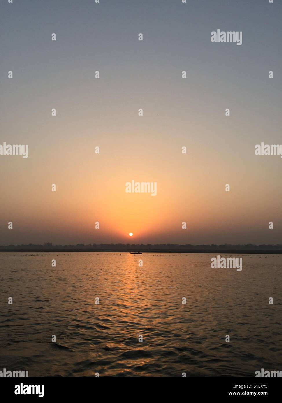 Sunrise over the river Ganges in Varanasi, India - Smartphone Captured Stock Image