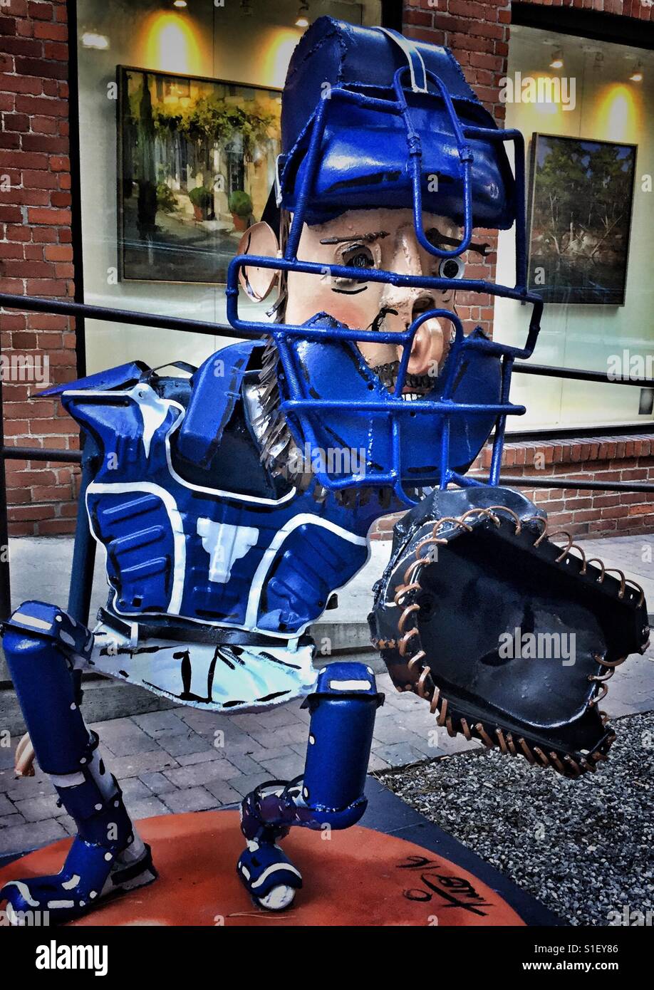 Baseball sculpture of a Blue Jay back catcher. - Smartphone Captured Stock Image