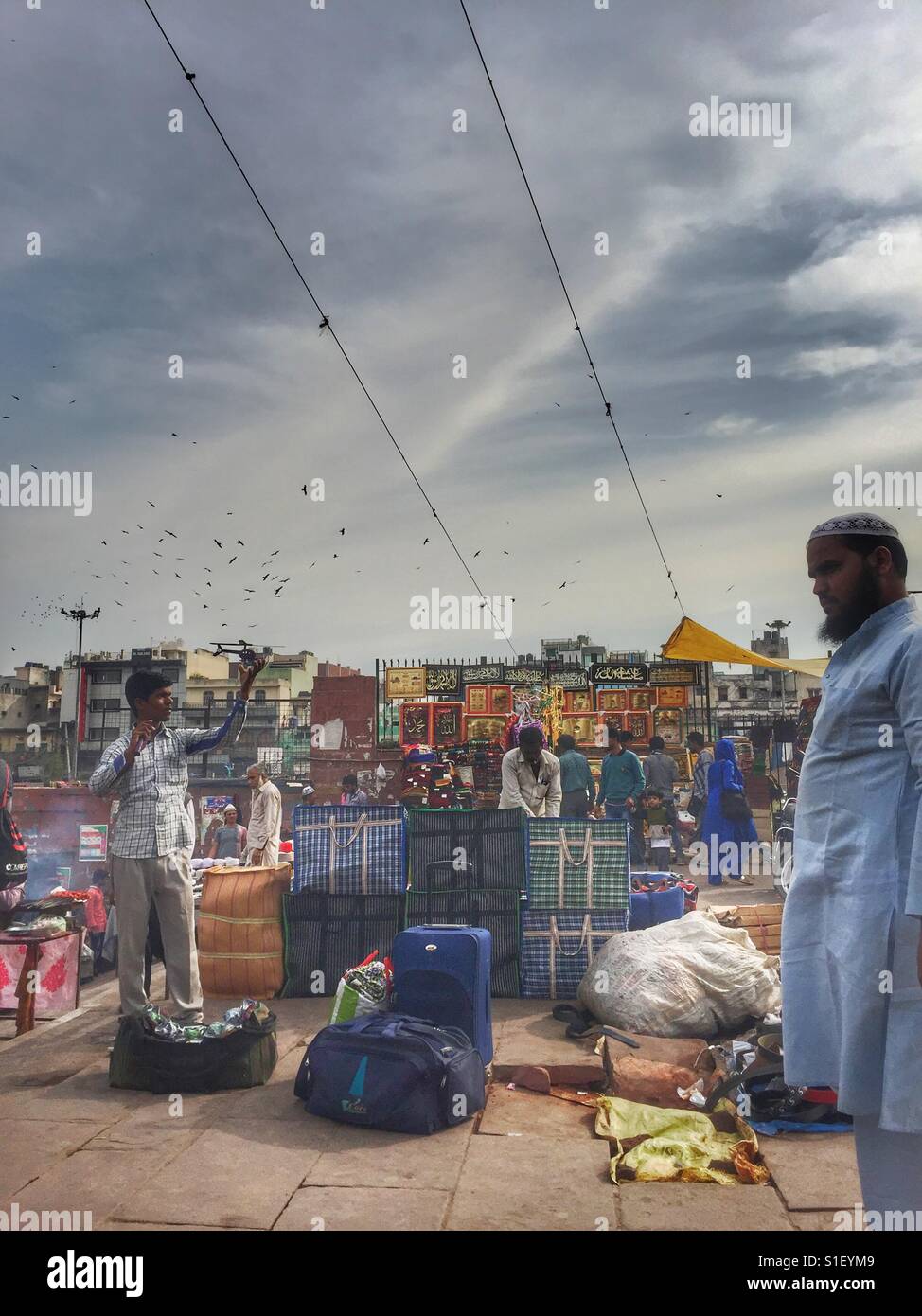 A vendor flys a toy helicopter in Delhi, India - Smartphone Captured Stock Image