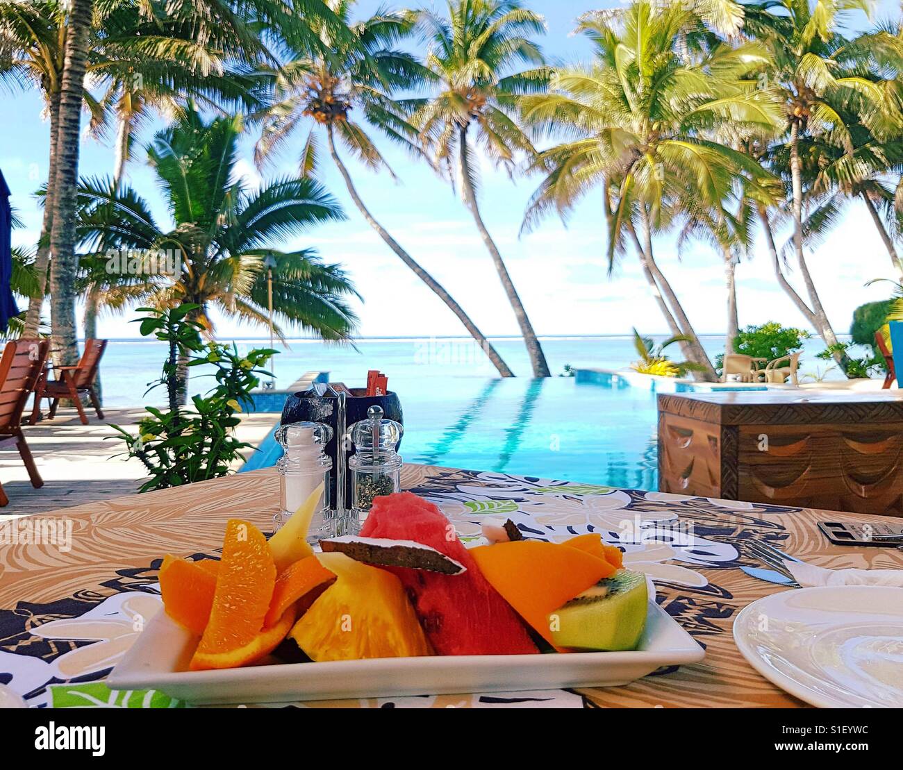 Fresh Fruit Platter Served At A Beachfront Resort In Rarotonga Infinity Pool And Palm Trees In The Background Stock Photo Alamy