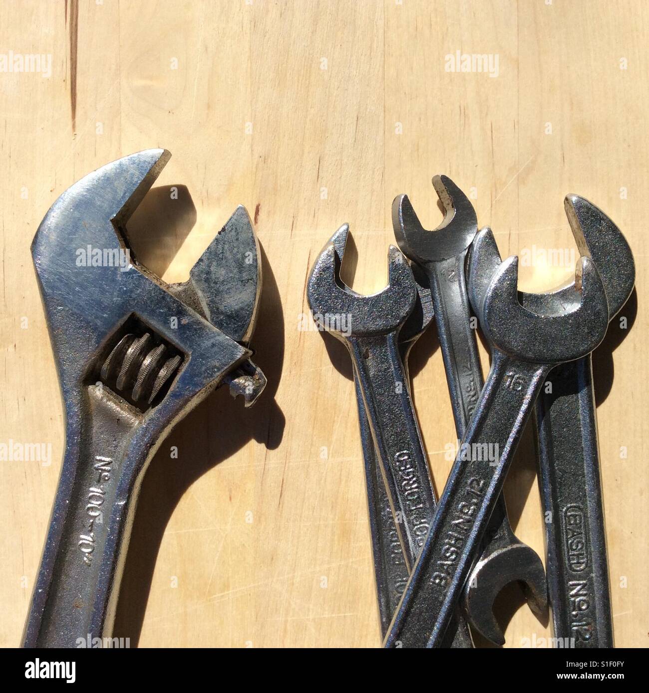 Adjustable wrench versus open end wrenches Stock Photo Alamy
