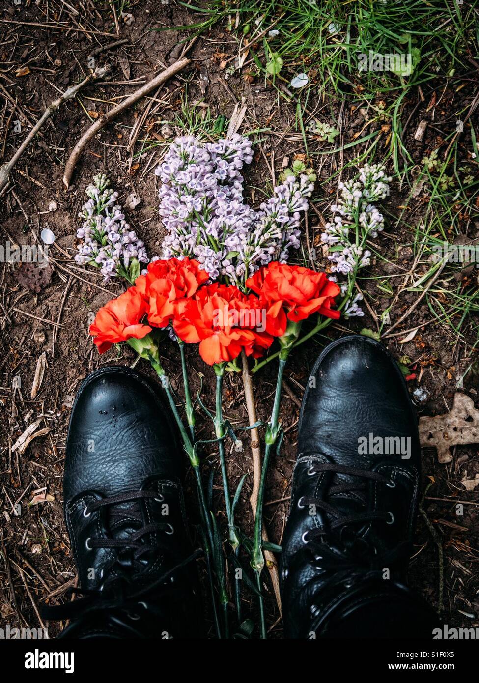 Flowers in between shoes - Smartphone Captured Stock Image
