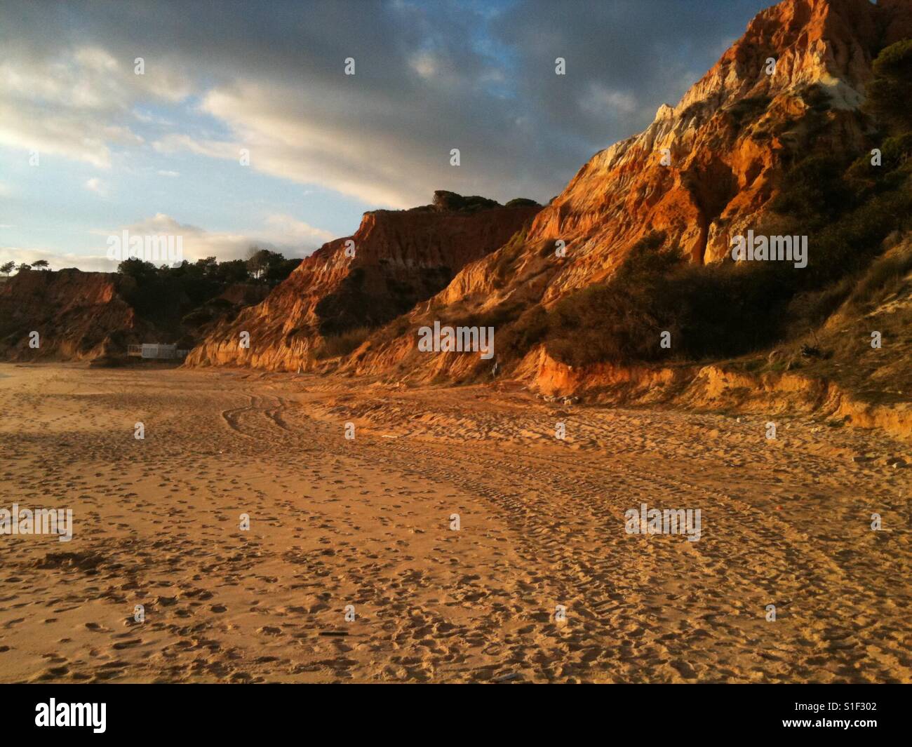 Beautiful unique dramatic golden beach in Portugal in winter - Smartphone Captured Stock Image