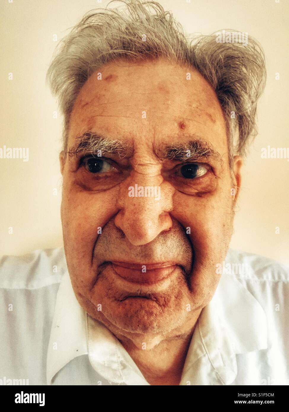 87-year old English man living with type 2 diabetes - Smartphone Captured Stock Image