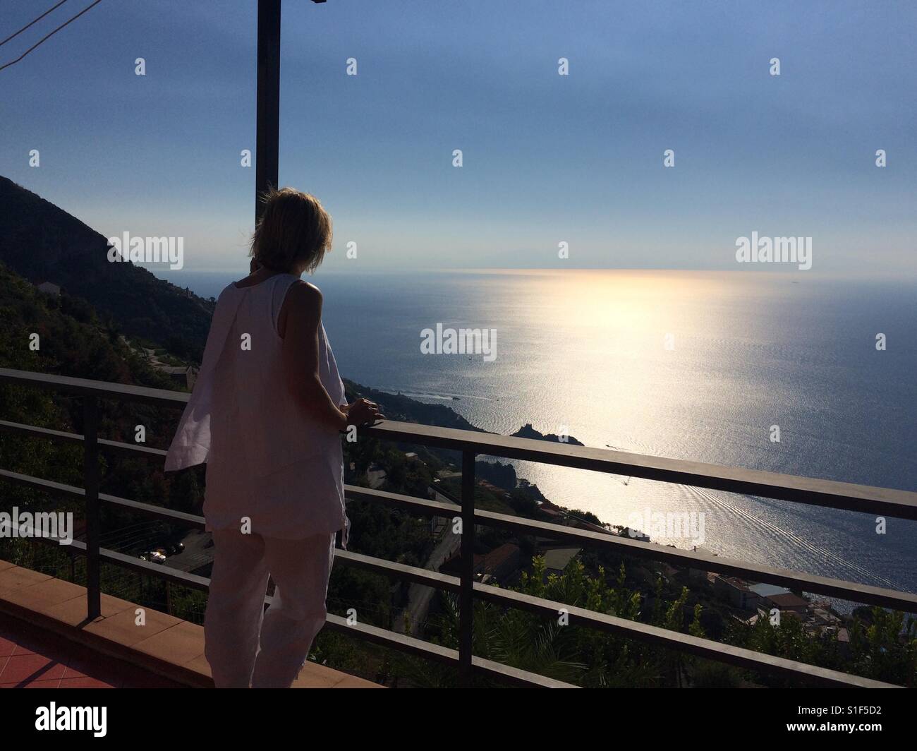 Woman admiring the view of the sea, Amalfi Coast, Italy Stock Photo