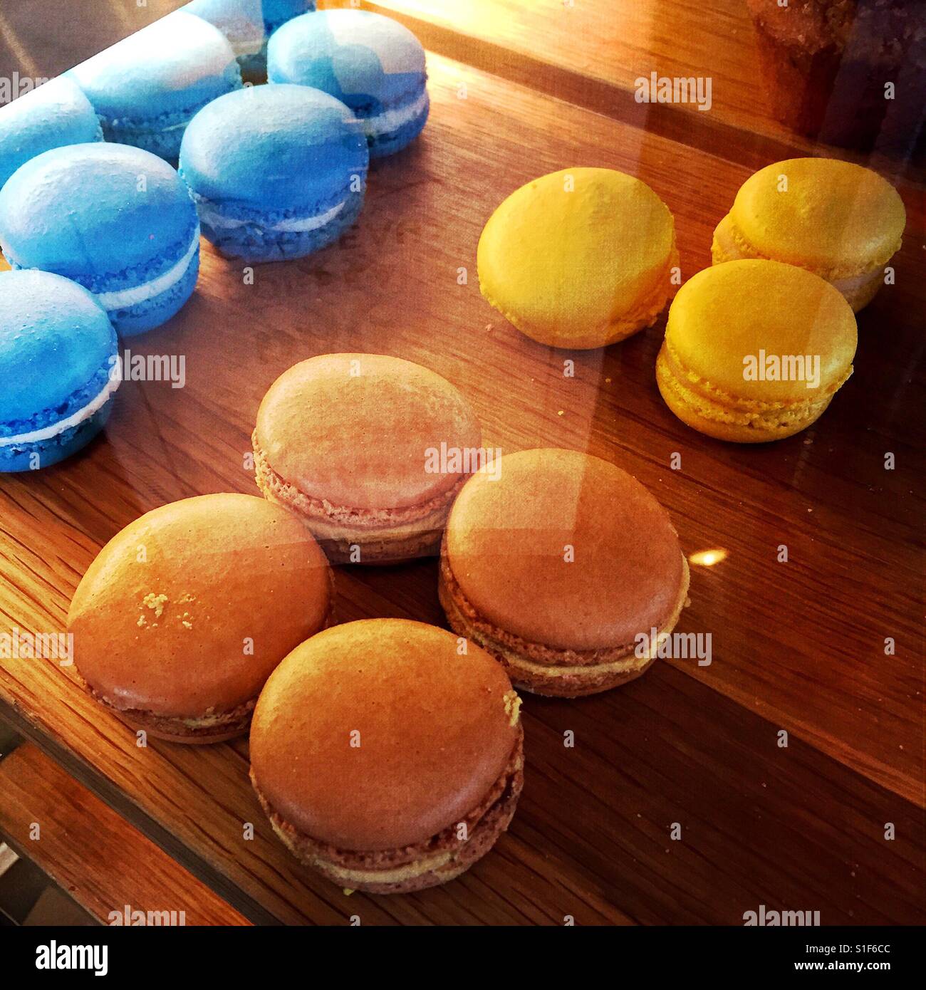 Macaroons Under A Glass Display Case In A Cafe Stock Photo Alamy