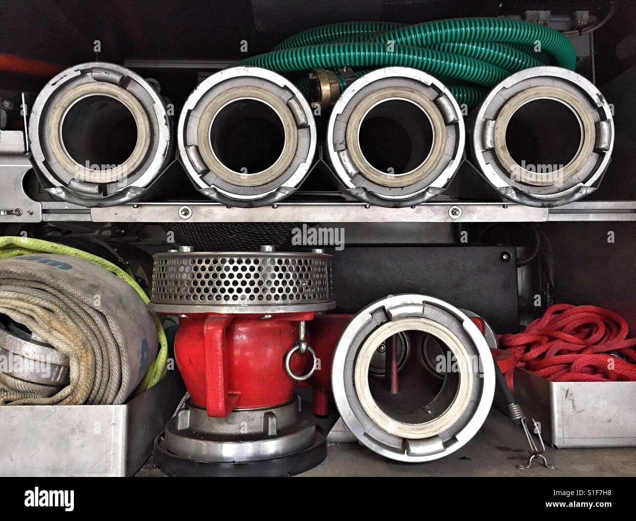 Fire fighting equipment in the compartment of a fire engine - Smartphone Captured Stock Image