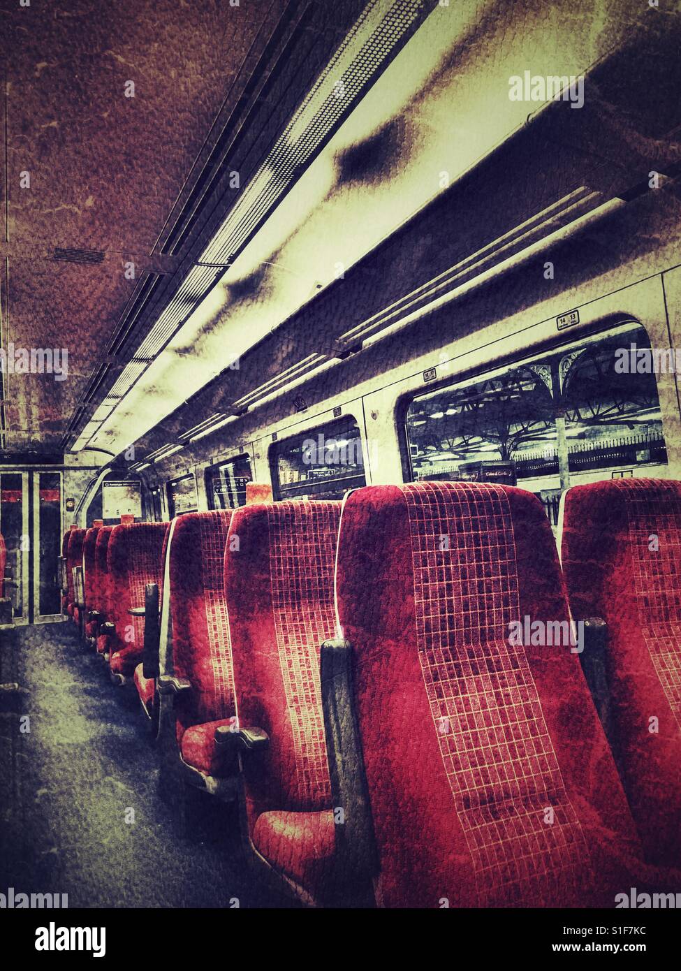 Empty seats in a rail carriage at night - Smartphone Captured Stock Image