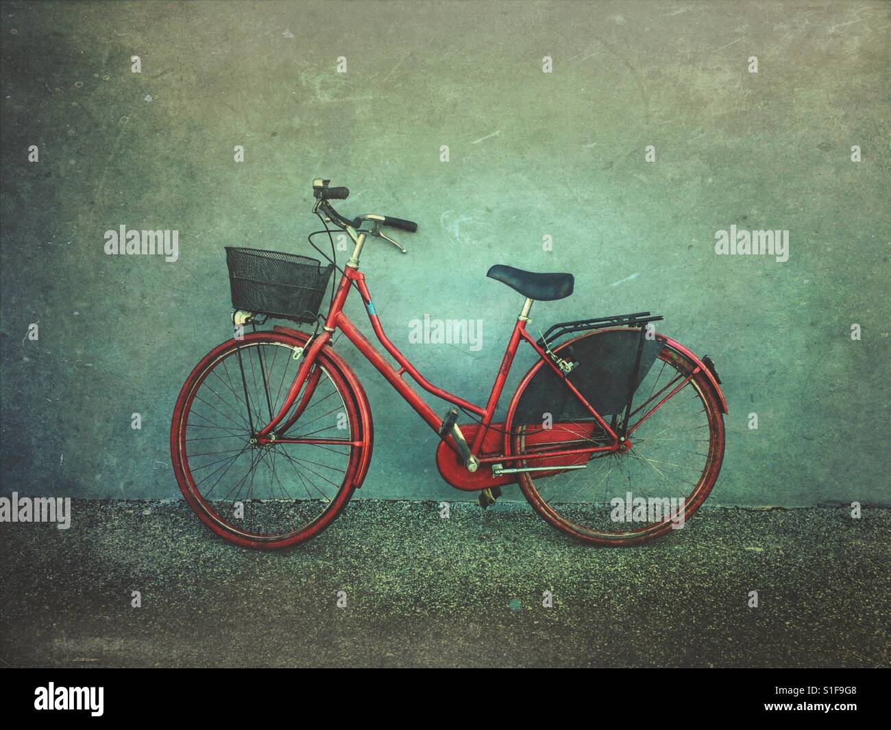 Red bicycle against a wall - Smartphone Captured Stock Image