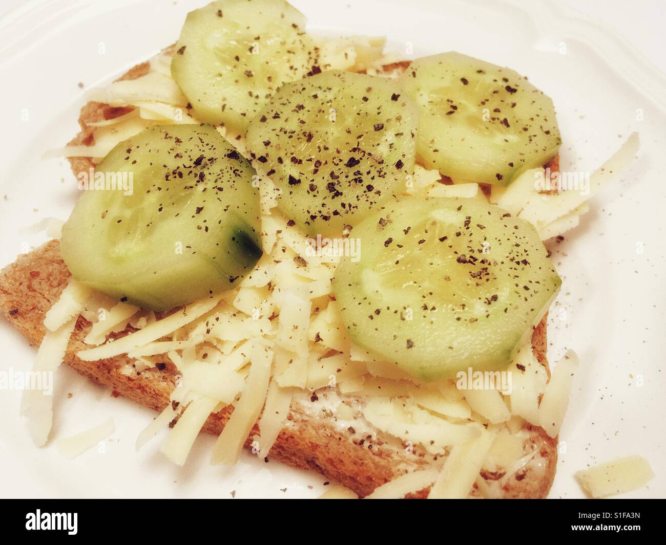 Grated cheddar cheese and cucumber sandwich - Smartphone Captured Stock Image