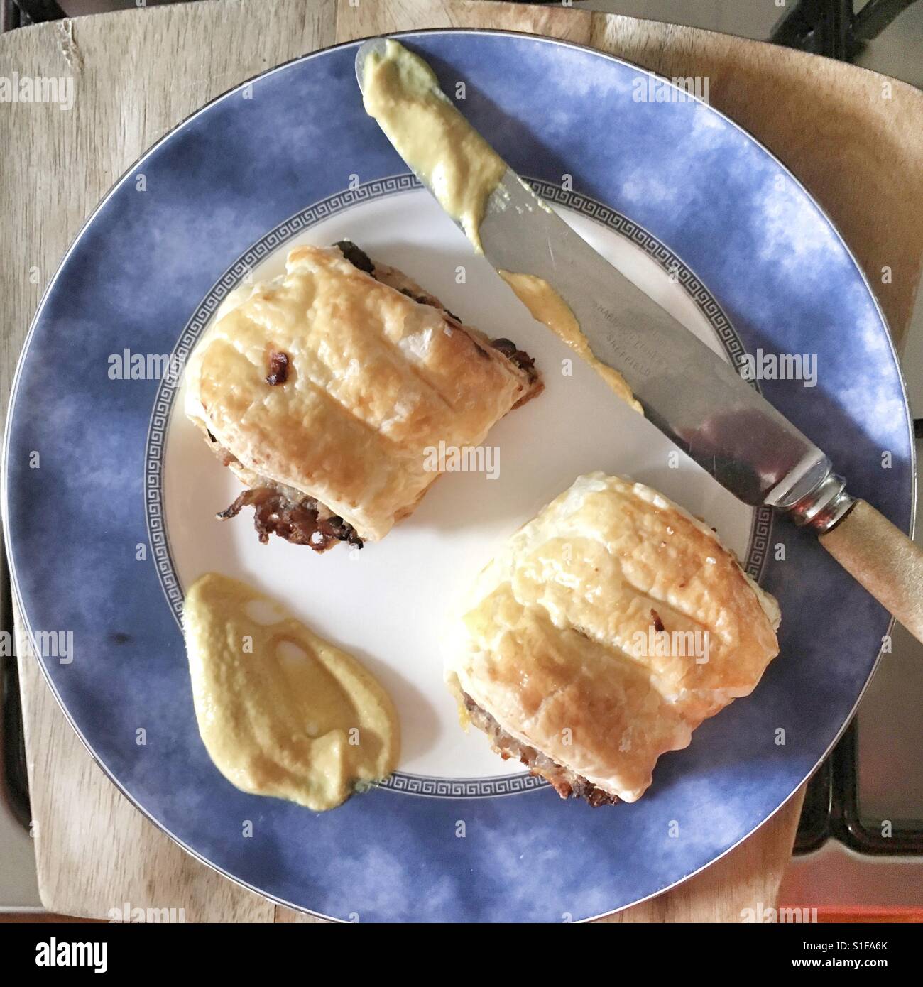 Homemade Sausage Rolls with Mustard. Stock Photo