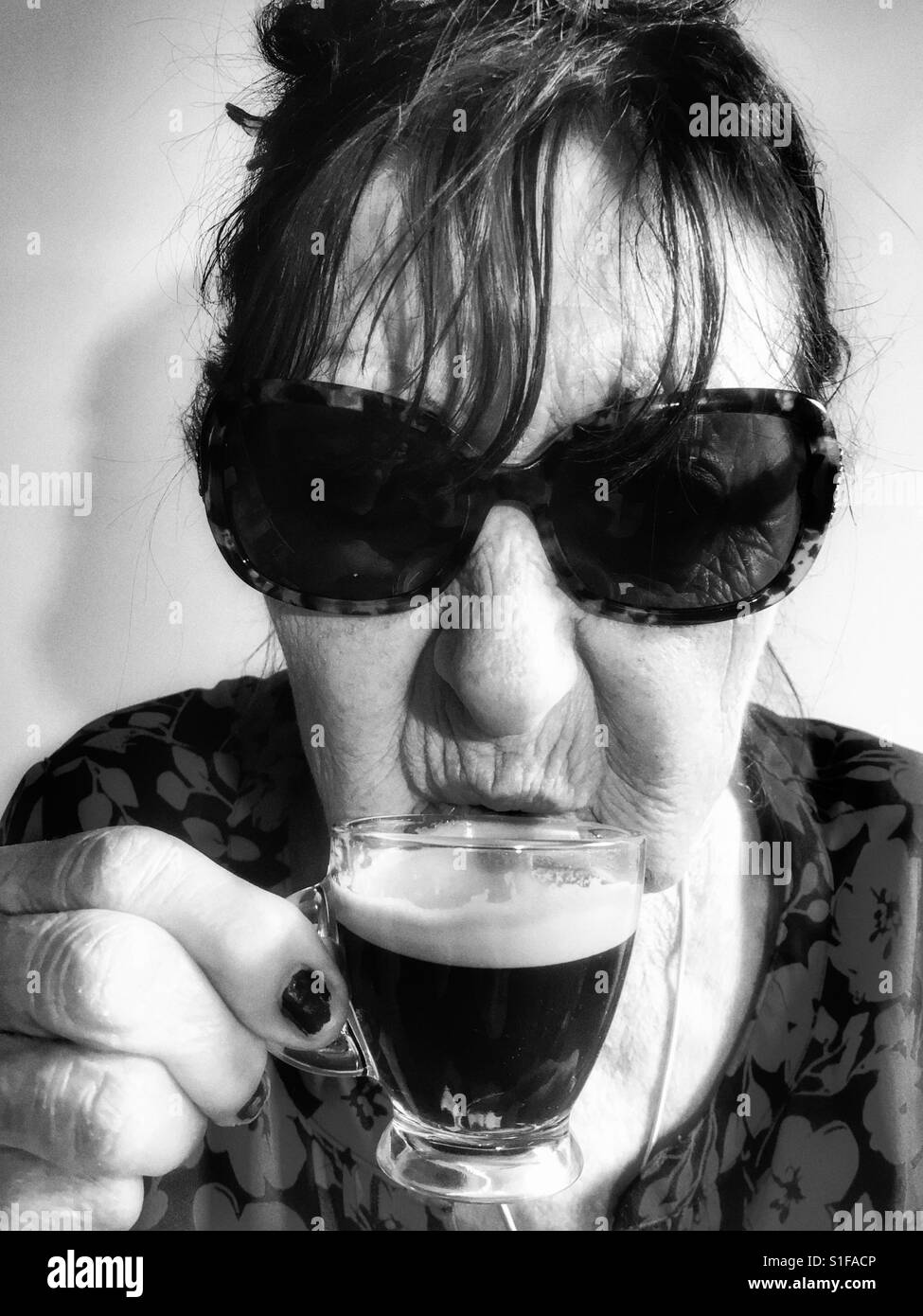 Woman drinking espresso coffee - Smartphone Captured Stock Image