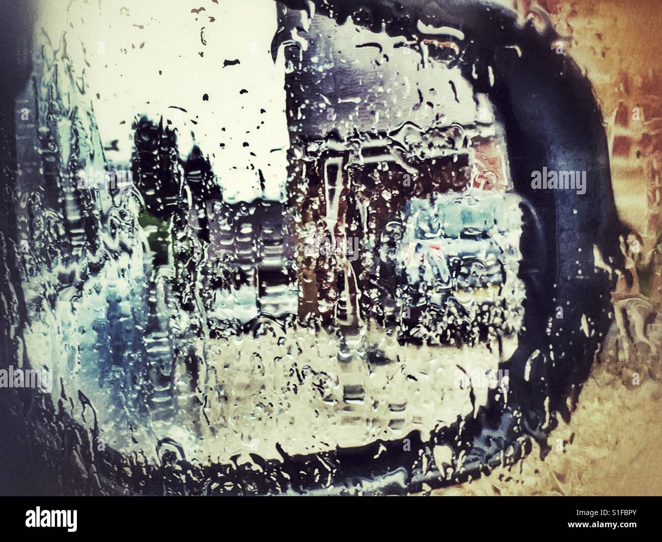 Wing mirror of car, reflection in rain - Smartphone Captured Stock Image