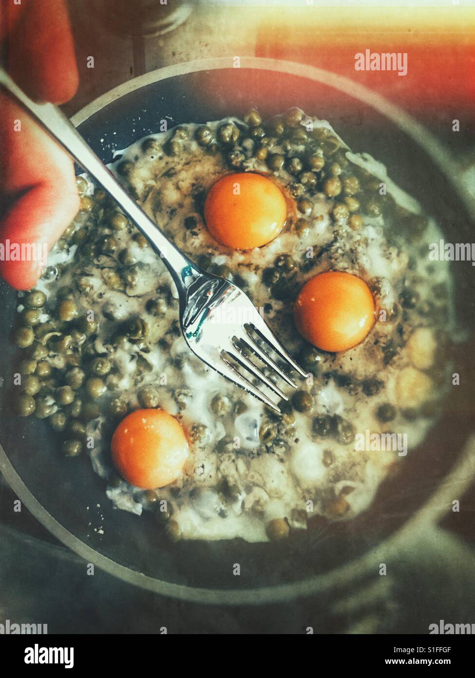 Breakfast menu scrambled eggs , grated parmesan cheese and green bans