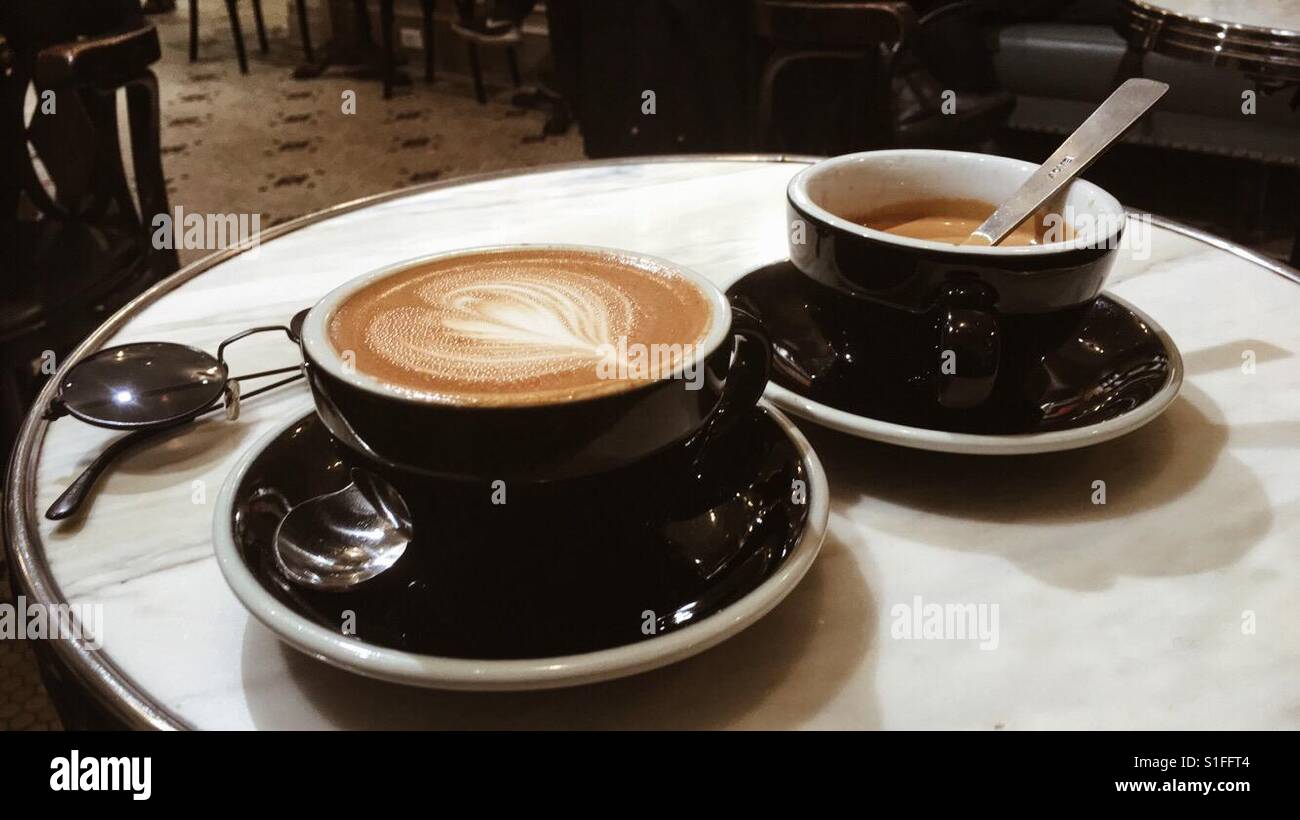 Two coffees on marble table Stock Photo