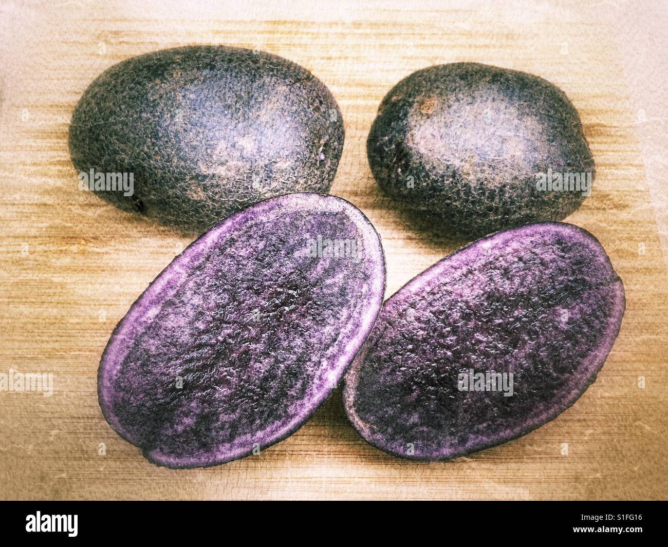 Purple potatoes, Salad Blue variety, also called Dragon Egg. - Smartphone Captured Stock Image