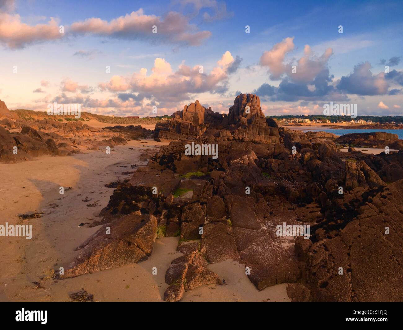 Golden hour in Cobo bay in channel island of Guernsey in England - Smartphone Captured Stock Image