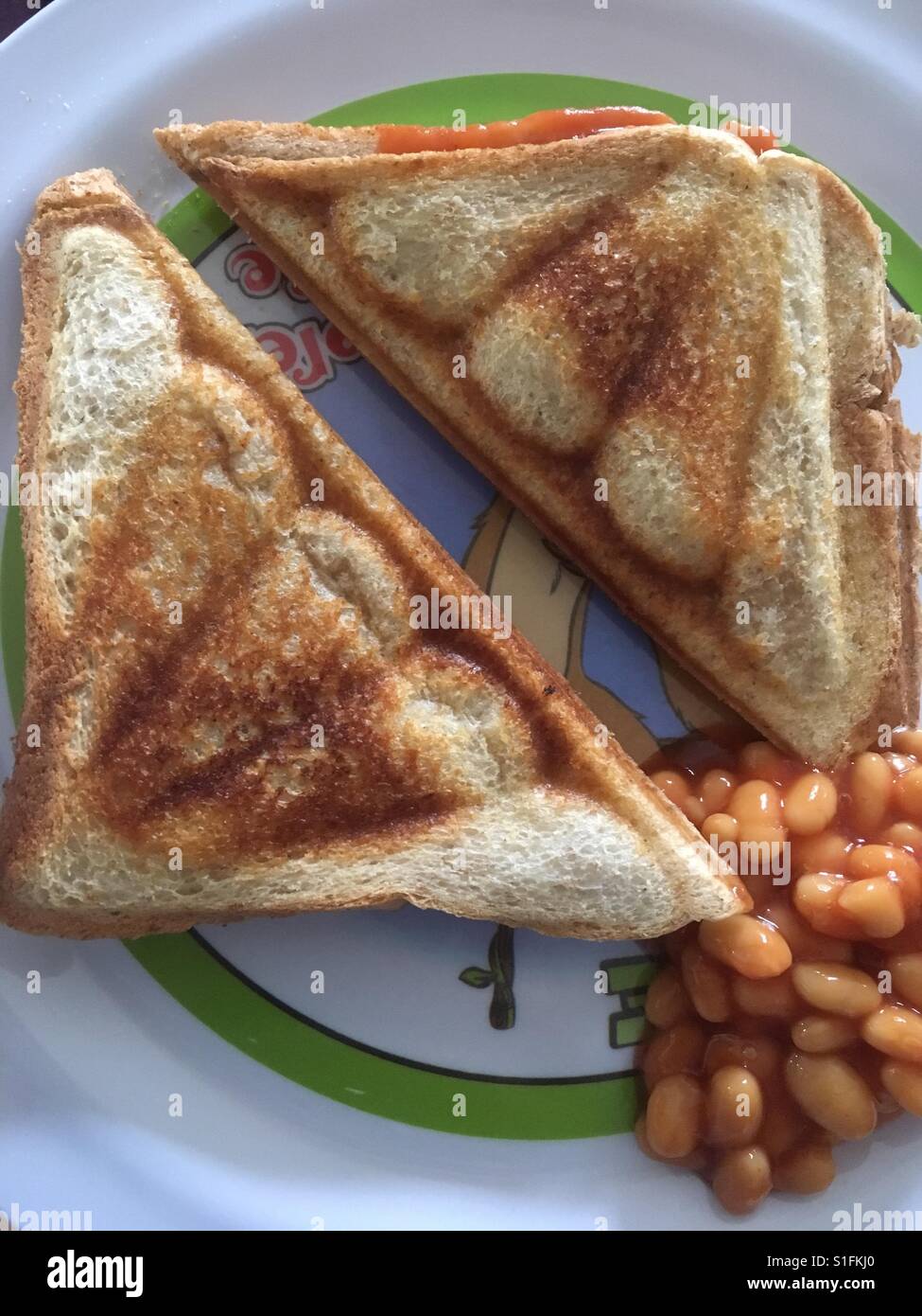Baked bean toastie with beans on the side Stock Photo Alamy