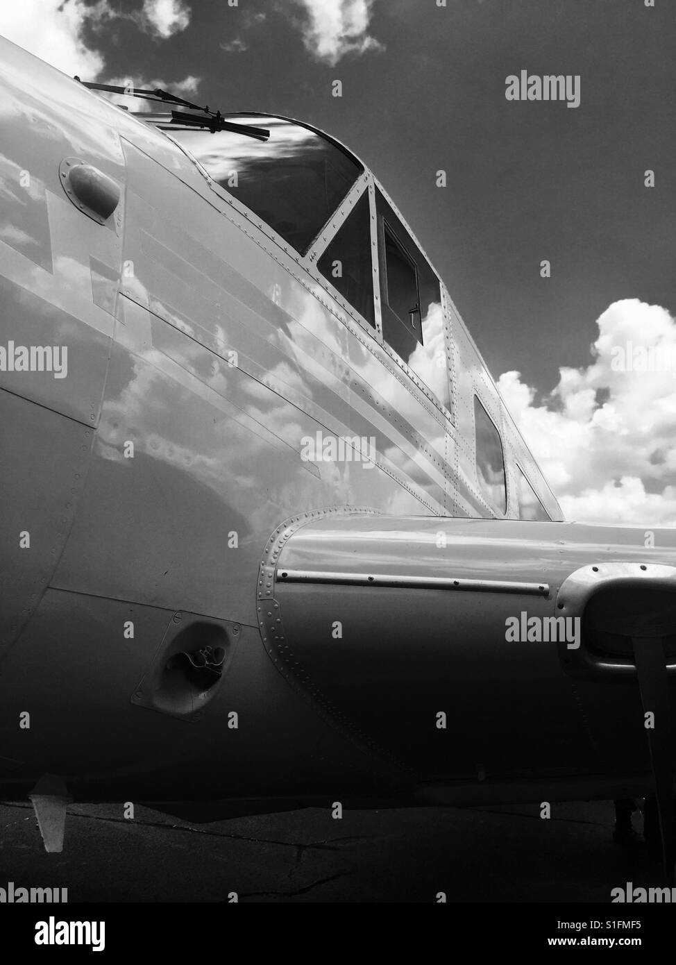 Classic aircraft with sky reflection Stock Photo