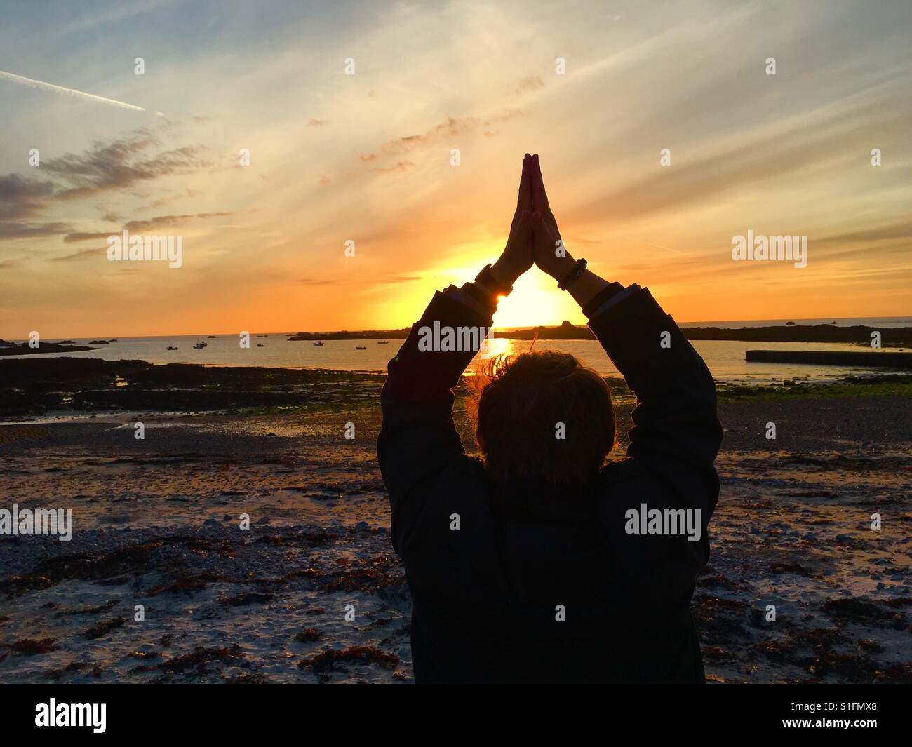 Sunset yoga on the beach - Smartphone Captured Stock Image
