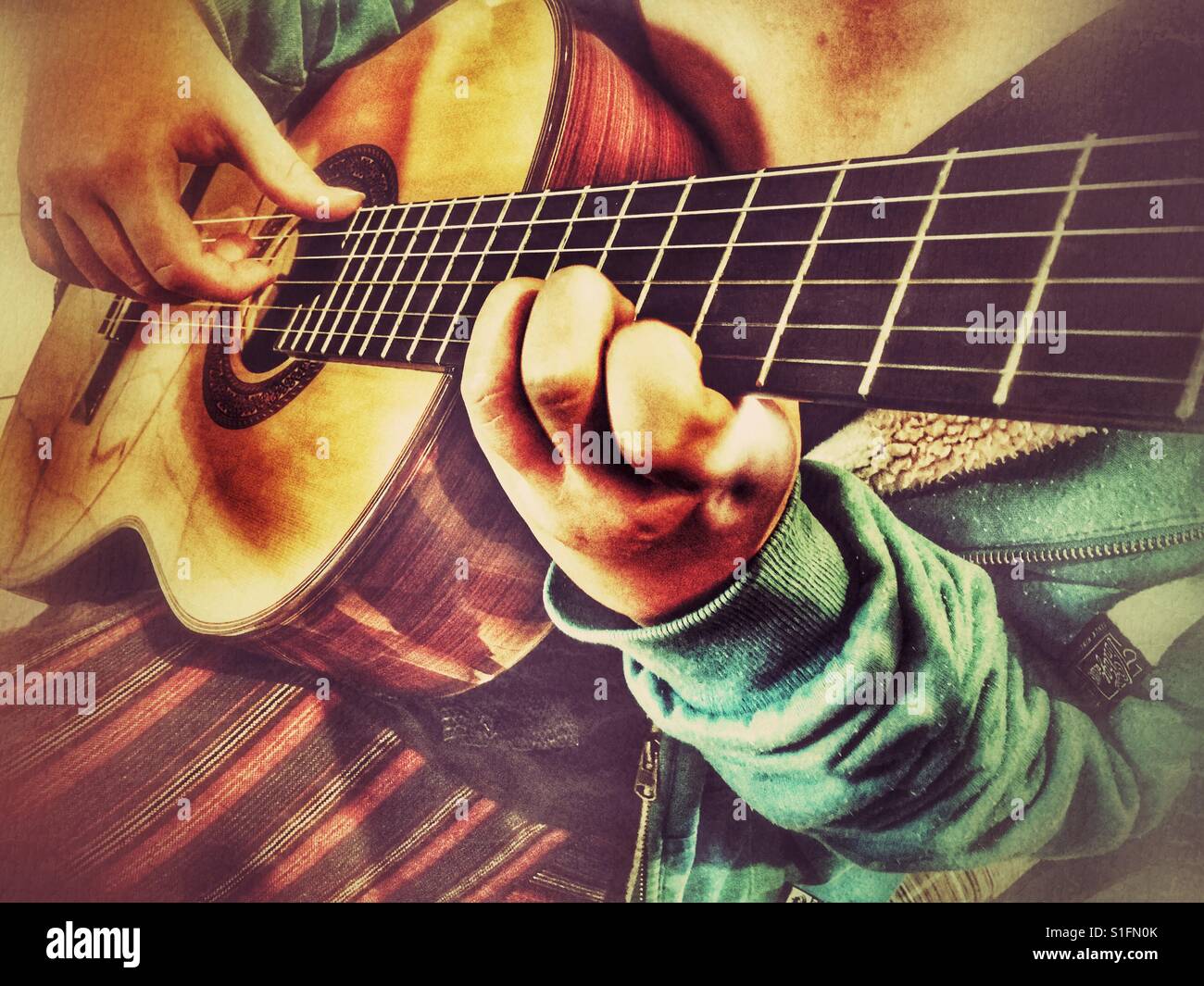 Playing a classical guitar - Smartphone Captured Stock Image