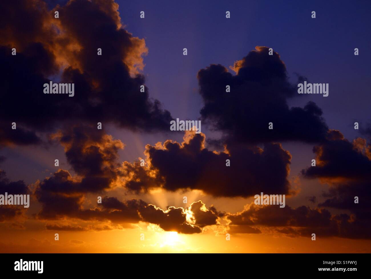 Sunset clouds sky Stock Photo - Alamy