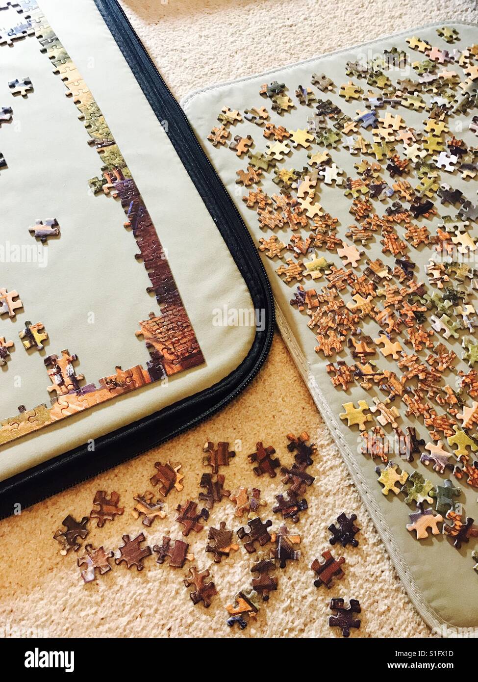 Doing a jigsaw at home Stock Photo Alamy